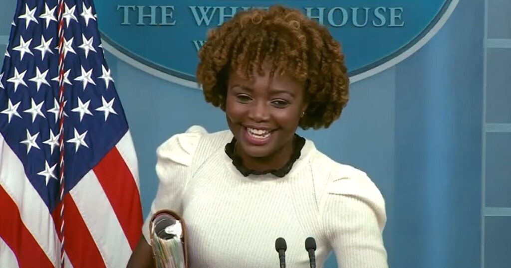 White House press secretary Karine Jean-Pierre giggles during her news briefing Thursday.