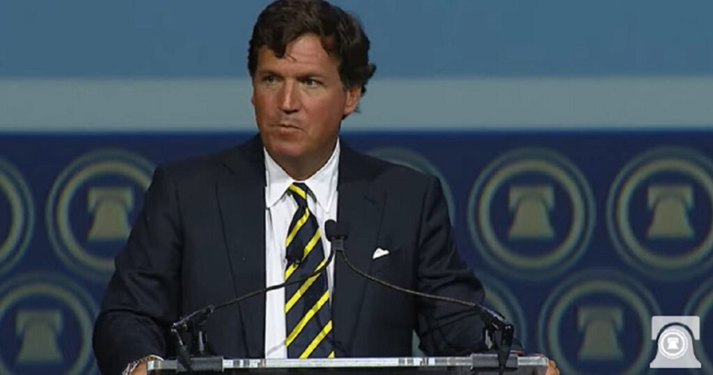 Now-former Fox News host Tucker Carlson delivers a speech Friday at The Heritage Foundation's 50th anniversary celebration outside Washington, D.C.